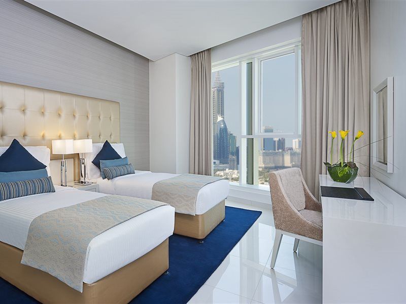 Damac Maison The Vogue Dubai Exterior foto A guest room at the Address Downtown Hotel