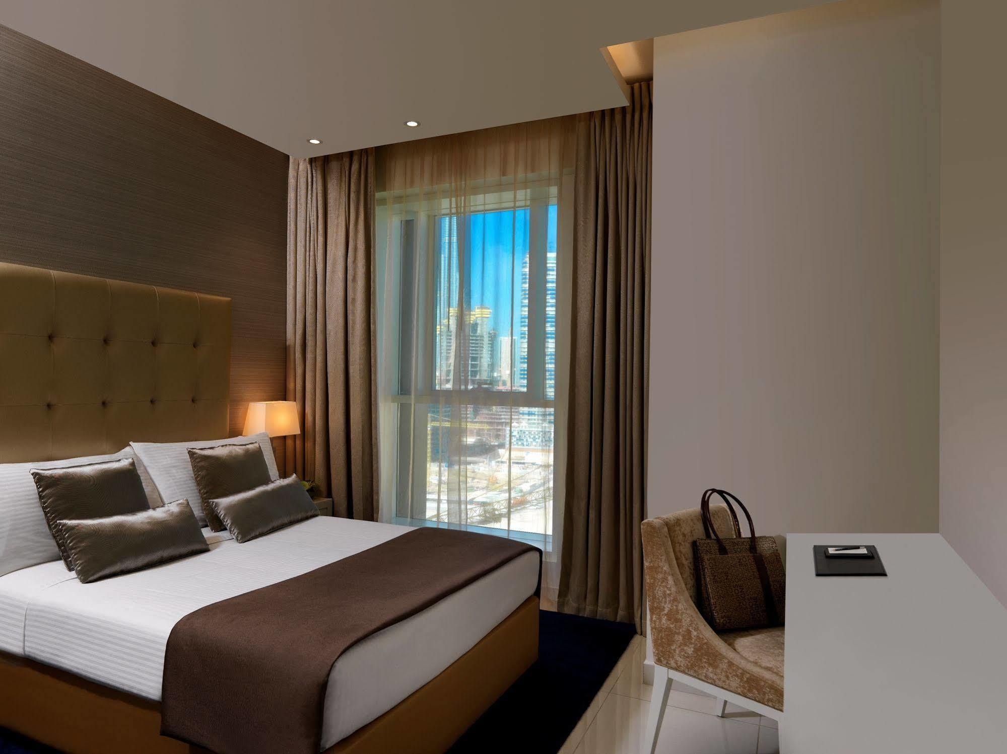 Damac Maison The Vogue Dubai Exterior foto A bedroom at the hotel